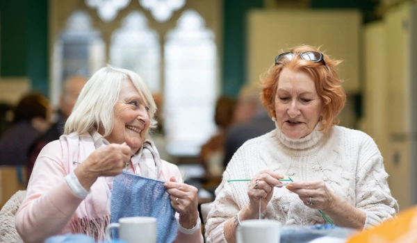 Two Happy Older Women Knitting Together