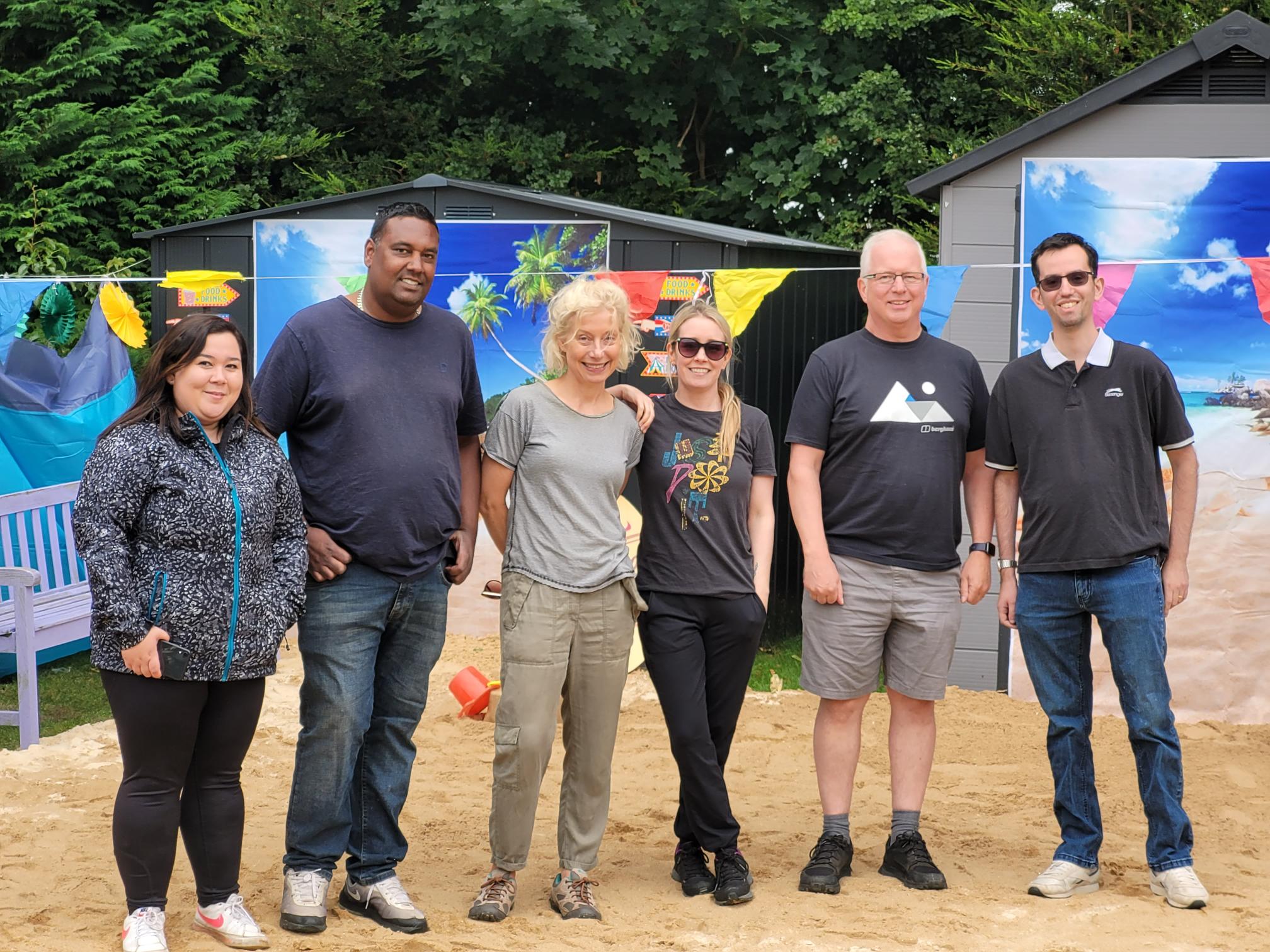 Abbeyfield Living Society Staff Volunteering To Transform The Garden Into A Beach At Pratt House