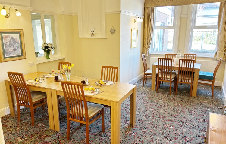 Dining Room At Abbeyfield West Wight With Set Tables