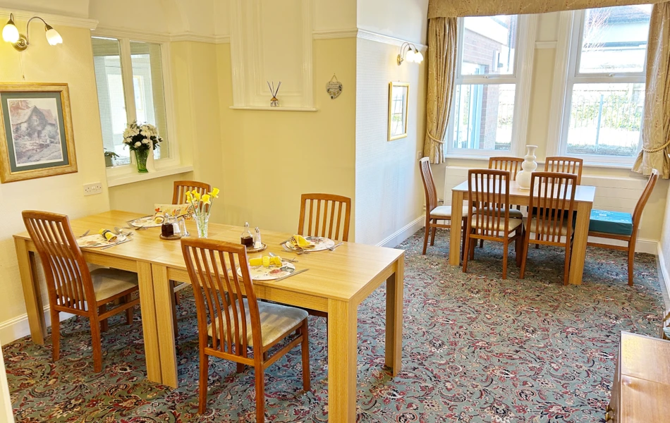 Dining Room At Abbeyfield West Wight With Set Tables