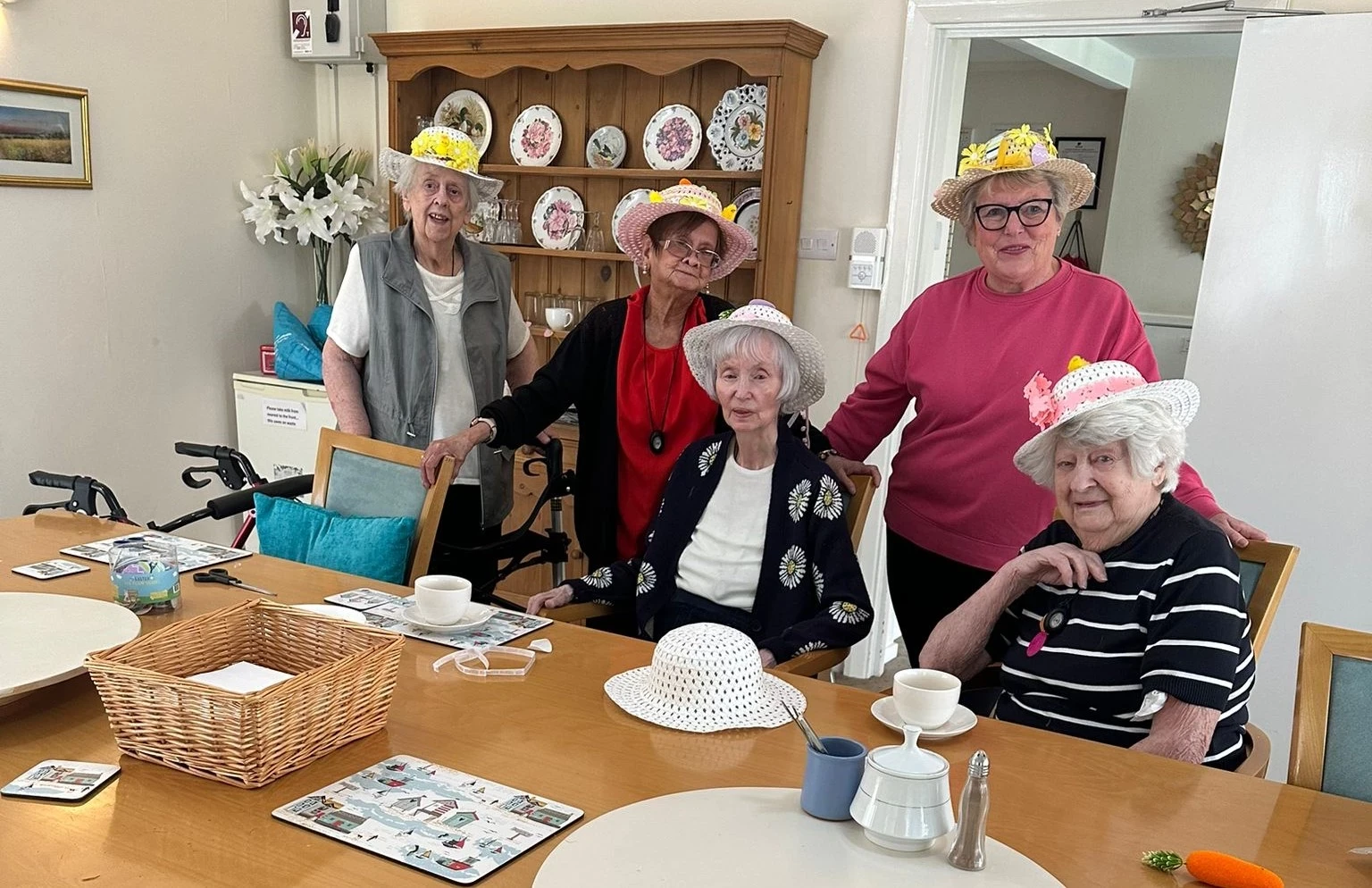 A group of women wearing easter bonnets