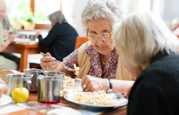 Residents sat eating together