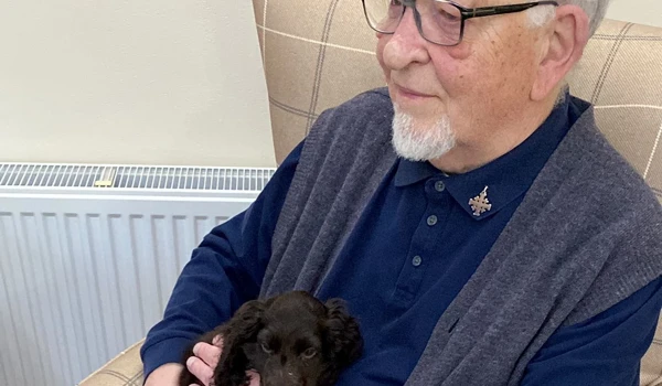 Twiglet Happy And Content Sitting With A Resident