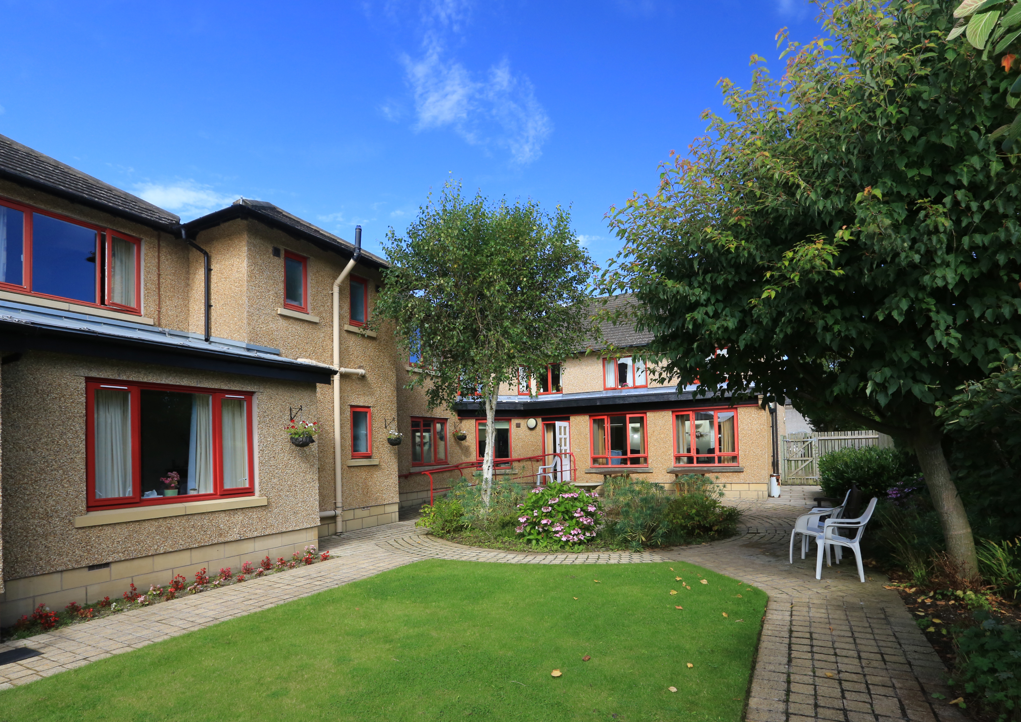 Chirnside House gardens with flower beds and seating