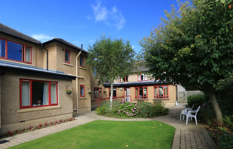 Chirnside House gardens with flower beds and seating