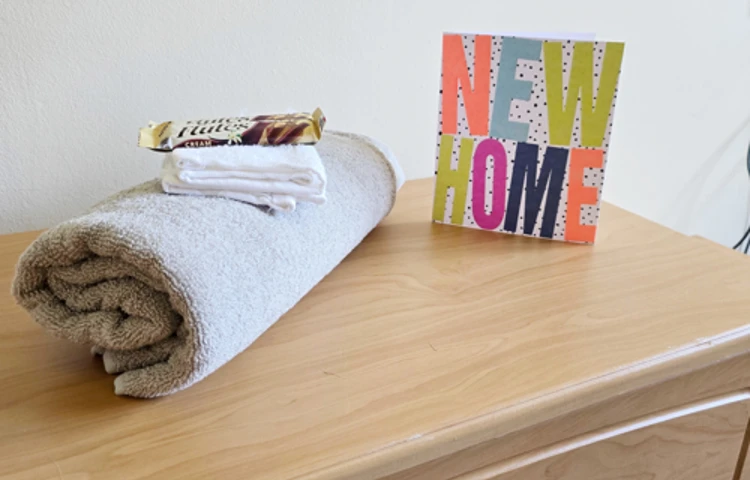 Side Cabinet With Towel Chocolate And New Home Card At Downing House, M20 4PP