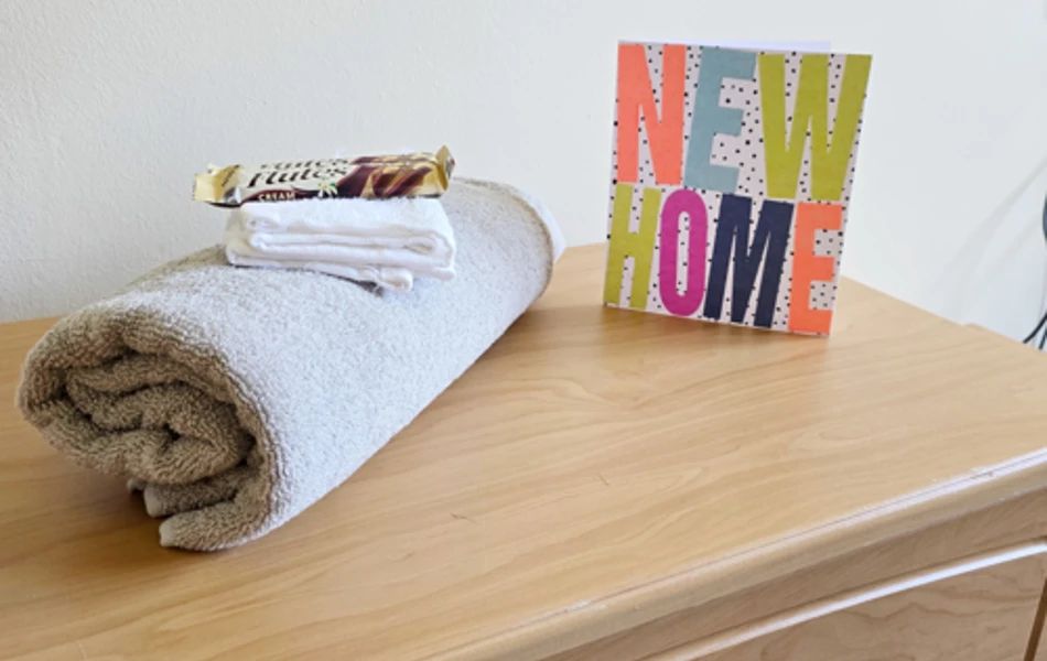 Side Cabinet With Towel Chocolate And New Home Card At Downing House, M20 4PP