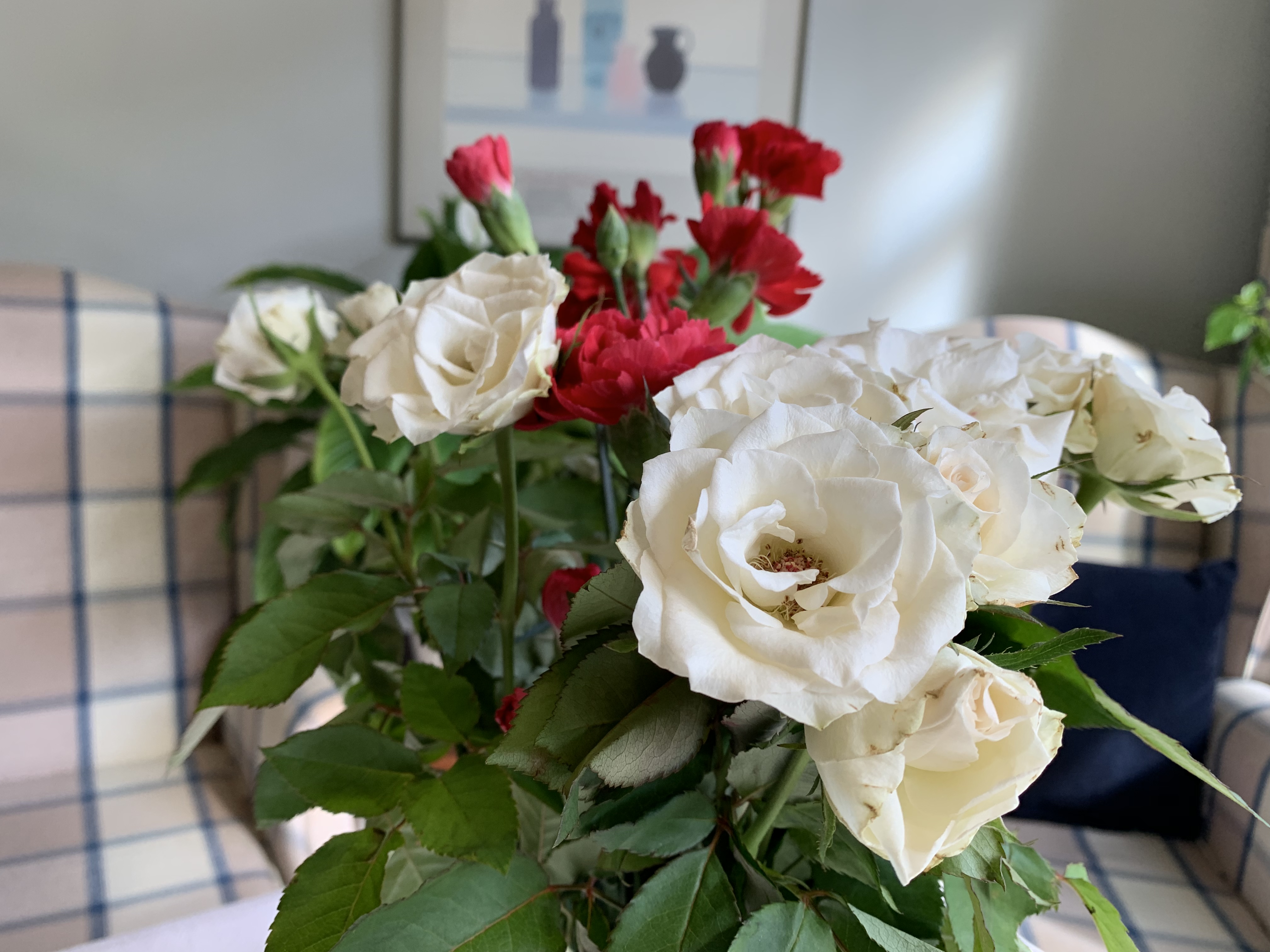 Beautiful roses and carnations in vase at Abbeyfield House, Dulwich