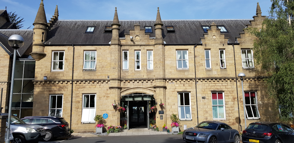 Outside entrance way to Grove House with its grand turrets