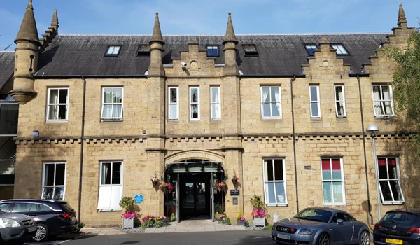 Outside entrance way to Grove House with its grand turrets