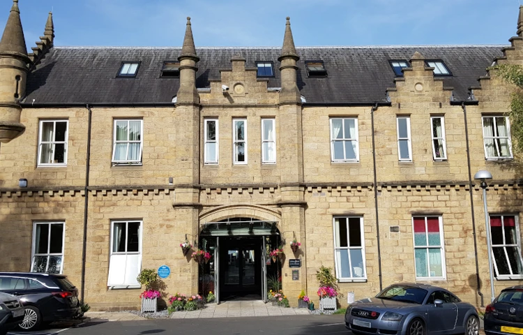 Outside entrance way to Grove House with its grand turrets