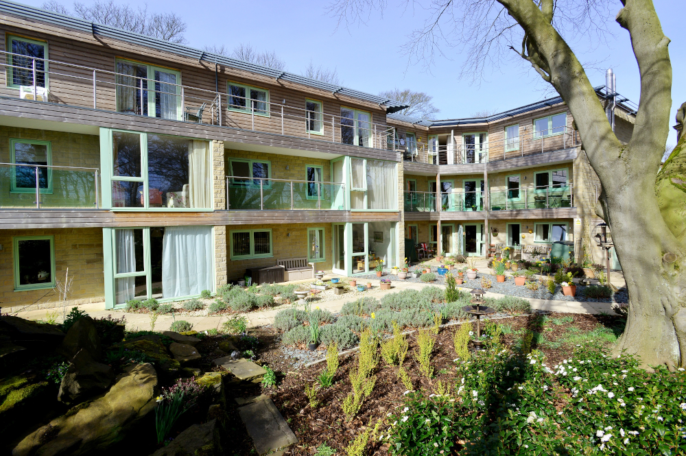 The rear of the house with glass balconies