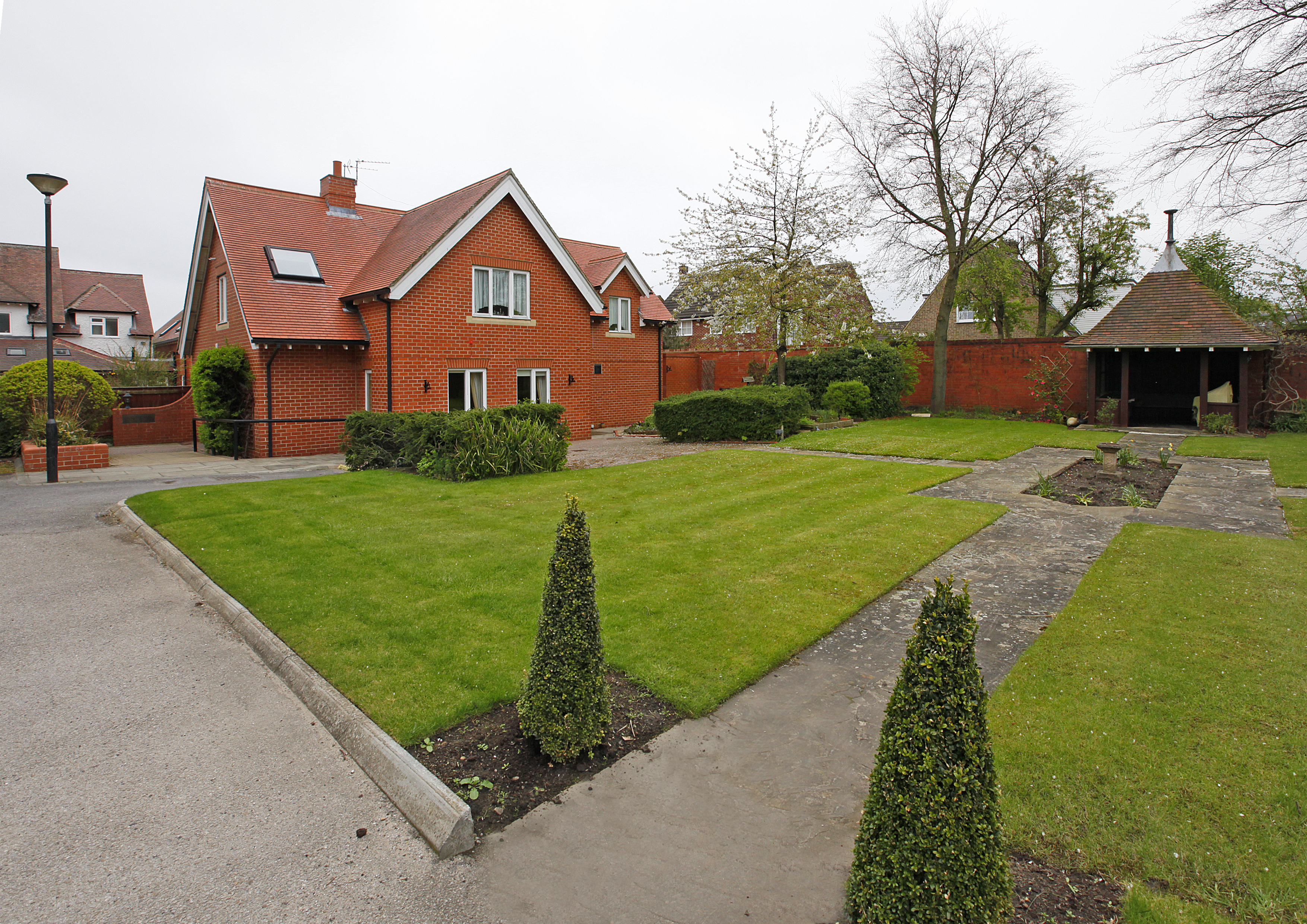 Well kept gardens with conifers and shrubs at Earl Keelan House DL3 8PD