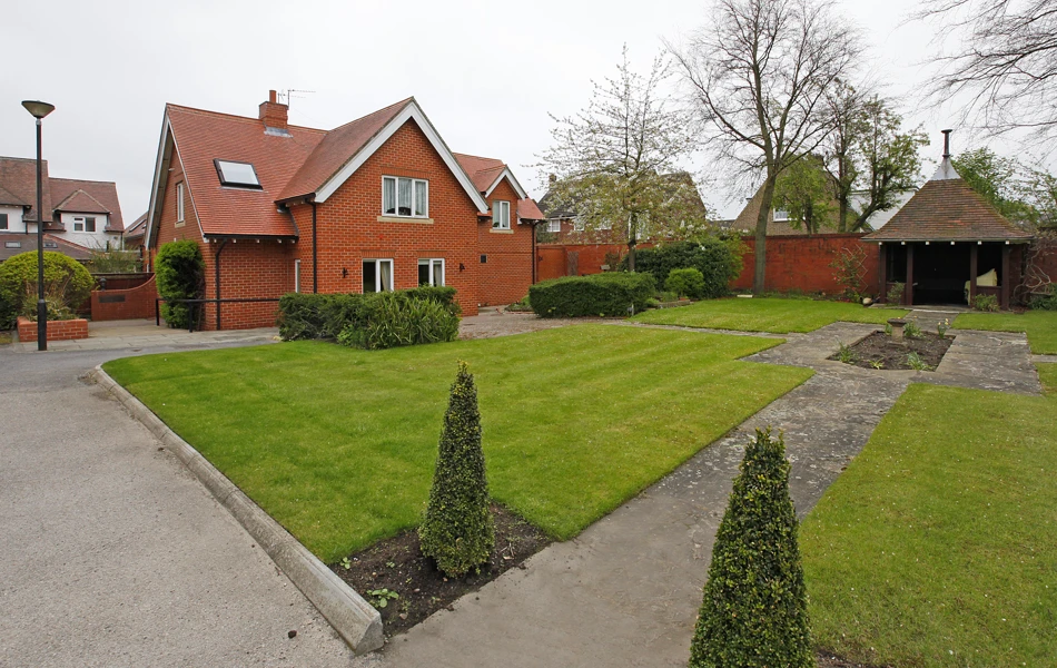 Well kept gardens with conifers and shrubs at Earl Keelan House DL3 8PD