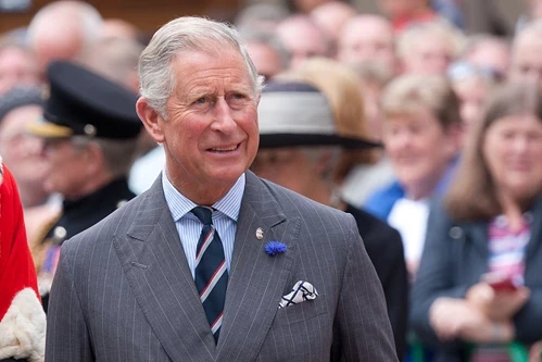 Prince Charles in a grey striped suit
