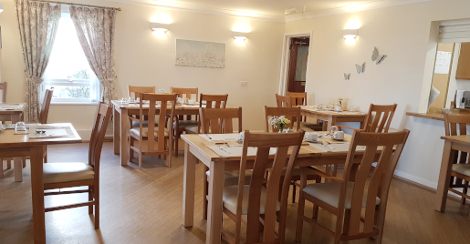 Lounge area with several tables and chairs