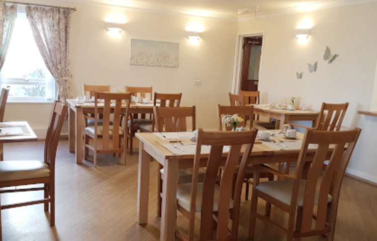 Lounge area with several tables and chairs