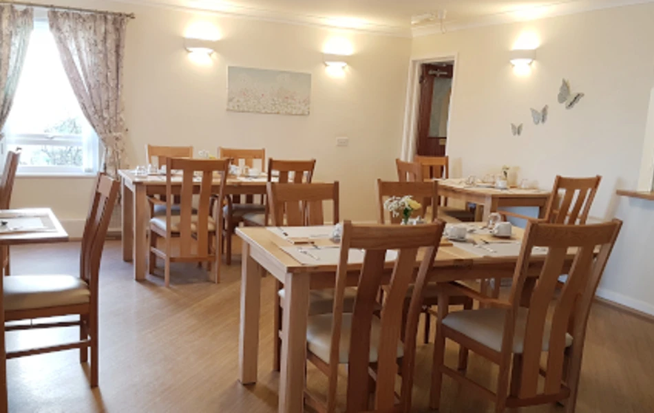 Lounge area with several tables and chairs