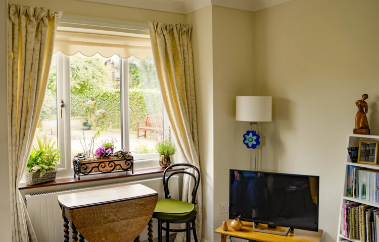 Room with side table and TV at Castle View House, BB7 2DT