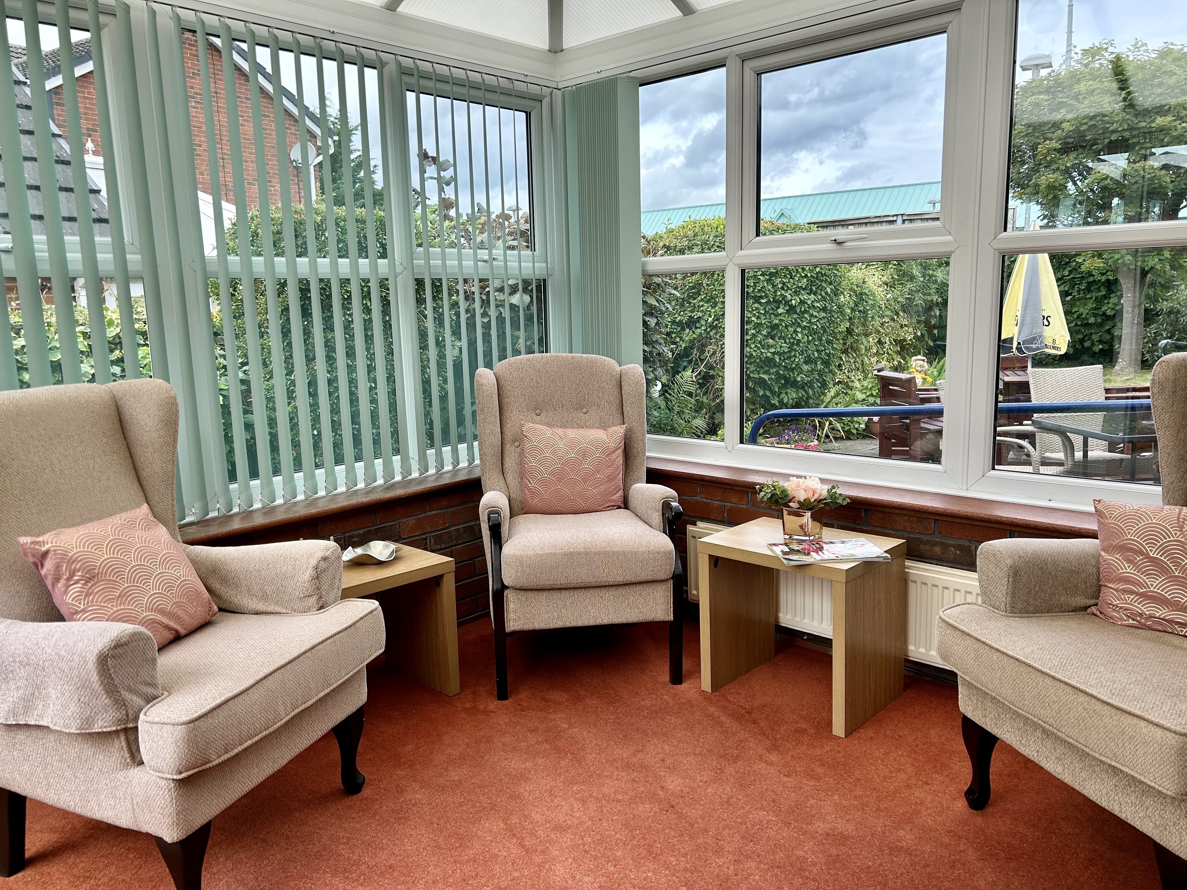 Our bright and airy conservatory with ample seating for residents