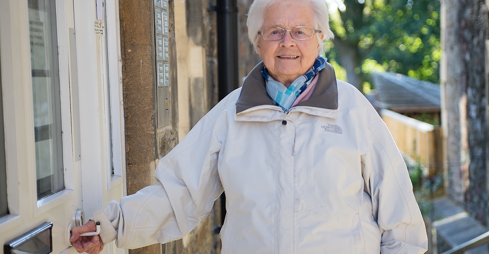 Resident at entrance to at Abbeyfield House, Bristol BS6 6YR