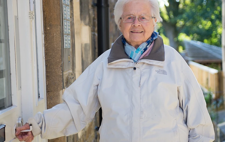 Resident at entrance to at Abbeyfield House, Bristol BS6 6YR