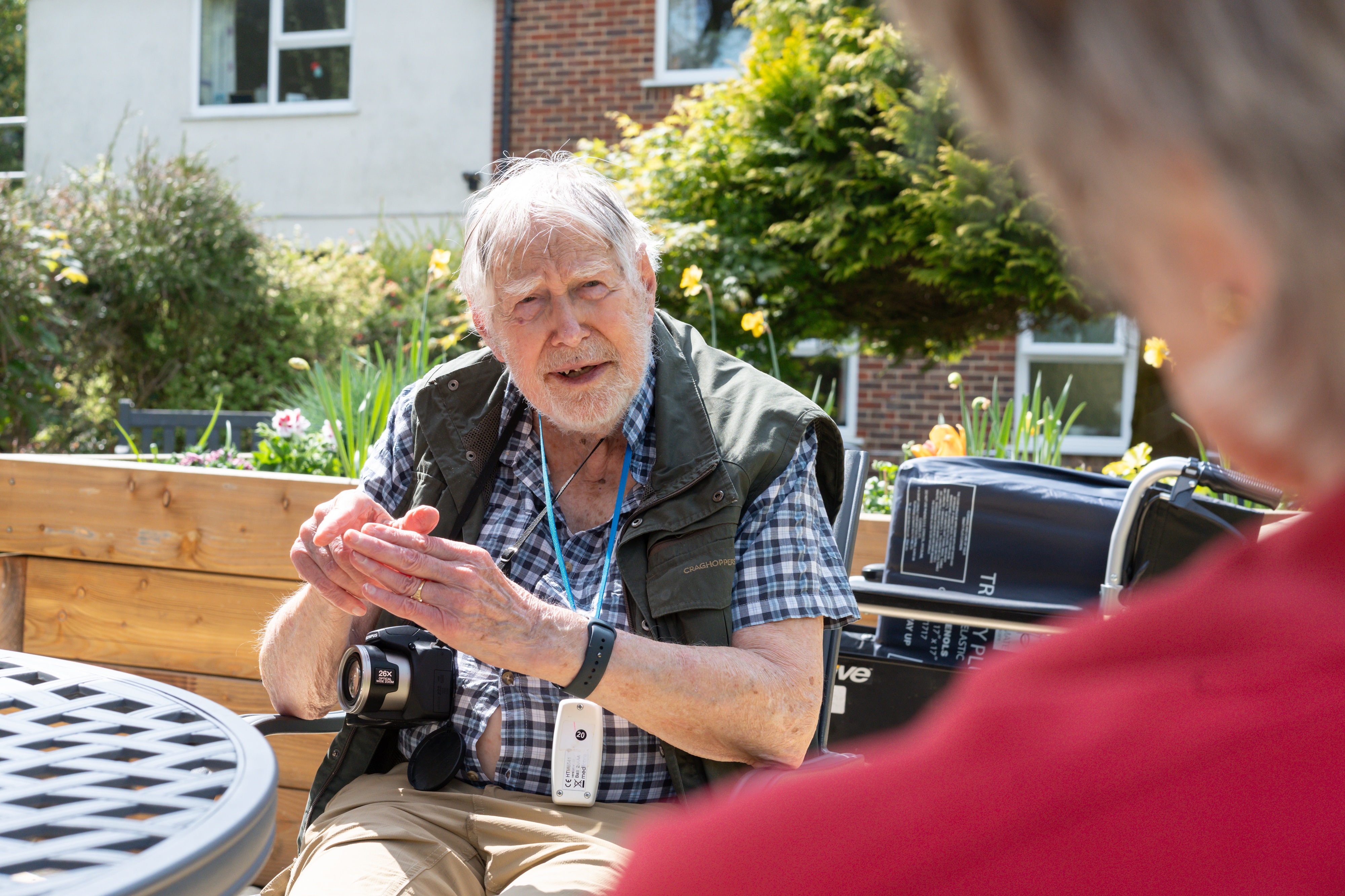 Resident Enjoying The Sunshine In The Garden At Nower House
