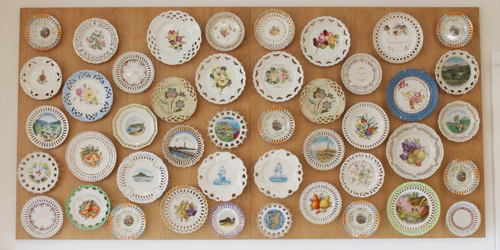 A wall of collectible plates