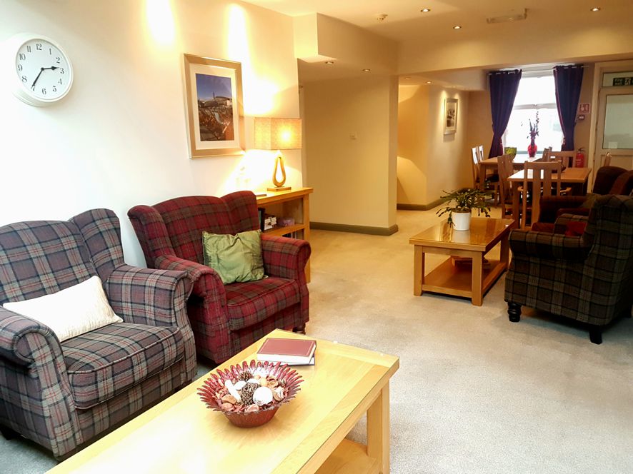 Bright lounge with tables and armchairs