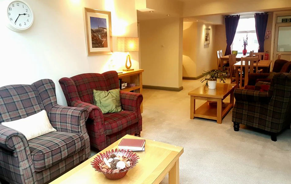 Bright lounge with tables and armchairs