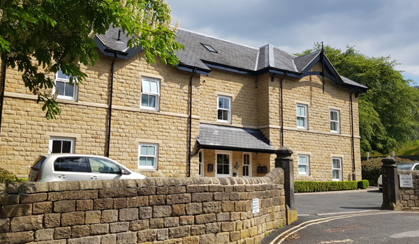 Front view of Abbeyfield House, a beautiful built stone house in Ikley, West Yorkshire
