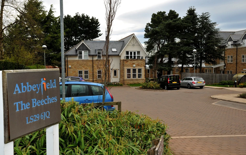 A large car park at the front of The Beeches independent Living in Menston, Ilkley, West Yorks