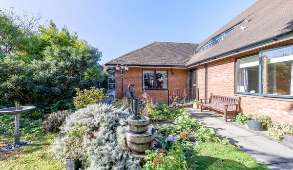 Winton House garden with bird bath and water feature