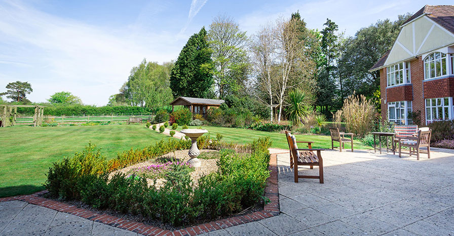 Peaceful and well-maintained garden at Westall House Residential Care Home in Horsted Keynes, providing a serene outdoor space for residents.