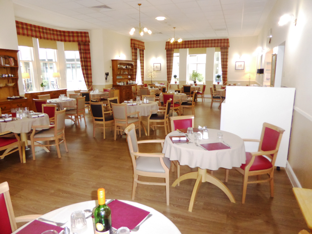 The lounge area with tables set for dinner