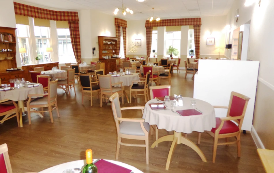 The lounge area with tables set for dinner