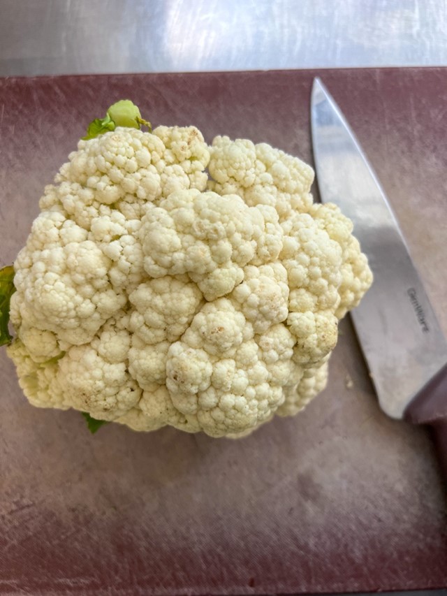 Cauliflower On A Chopping Board