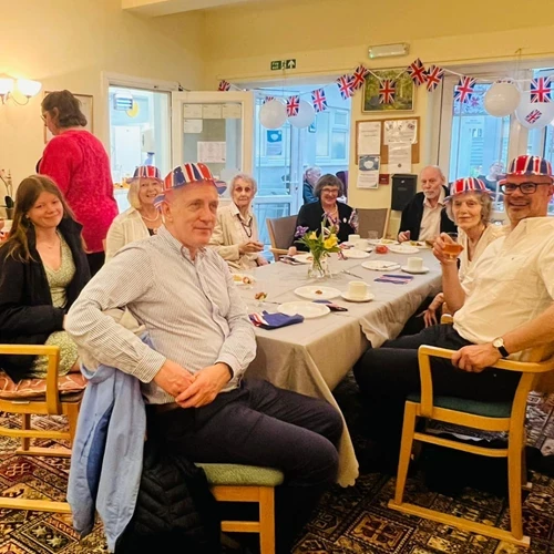 Table of people celebrating the Queens jubilee