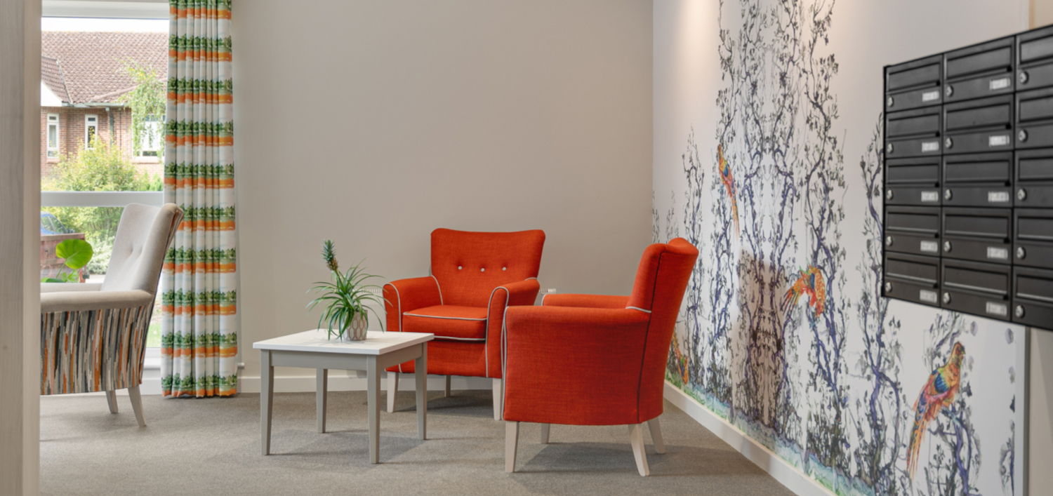 Bright Sitting Area With Orange Armchairs With A Colourful Mural, Abbeyfield House (IL), York Y024 1LL