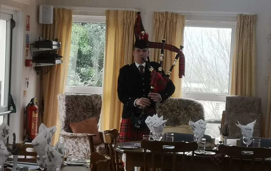 burns-night-piper at Abbeyfield House, Brecon LD3 7RT