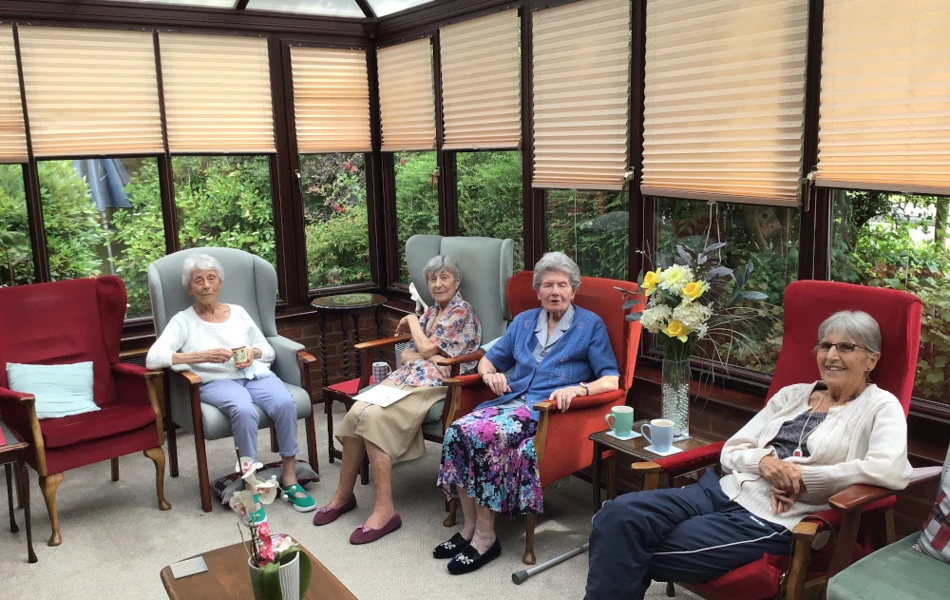 Residents in the conservatory at Archer House, Billericay CM12 9LD