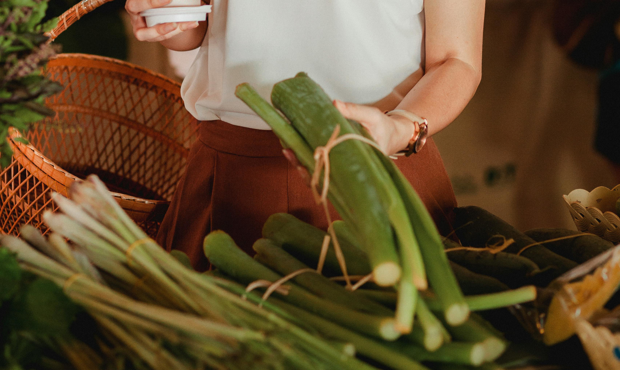 Woman Holding Vegetables And Drink