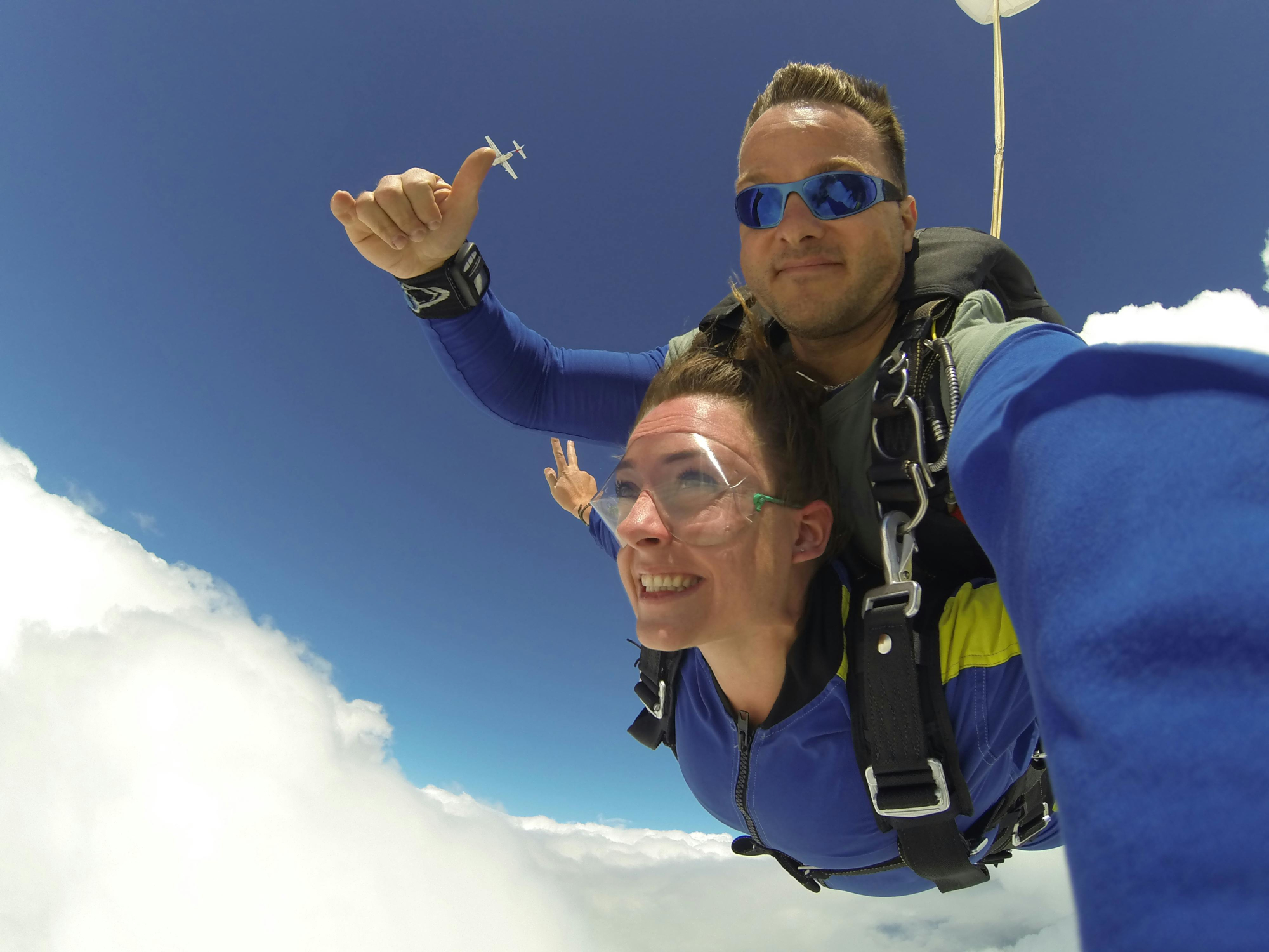 Two People Taking Part In A Skydive