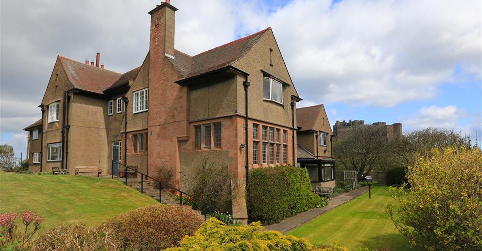 An outside view of Armstrong House and surrounding gardens