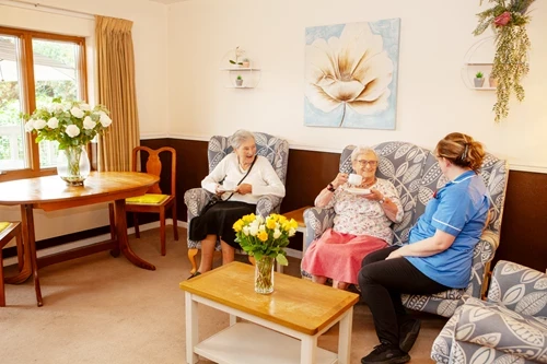 Residents and staff enjoying a cup of tea and a chat