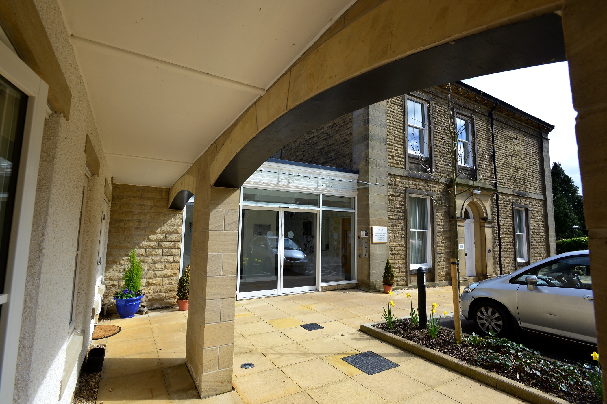 A view of the entrance under the archway at Woodlands