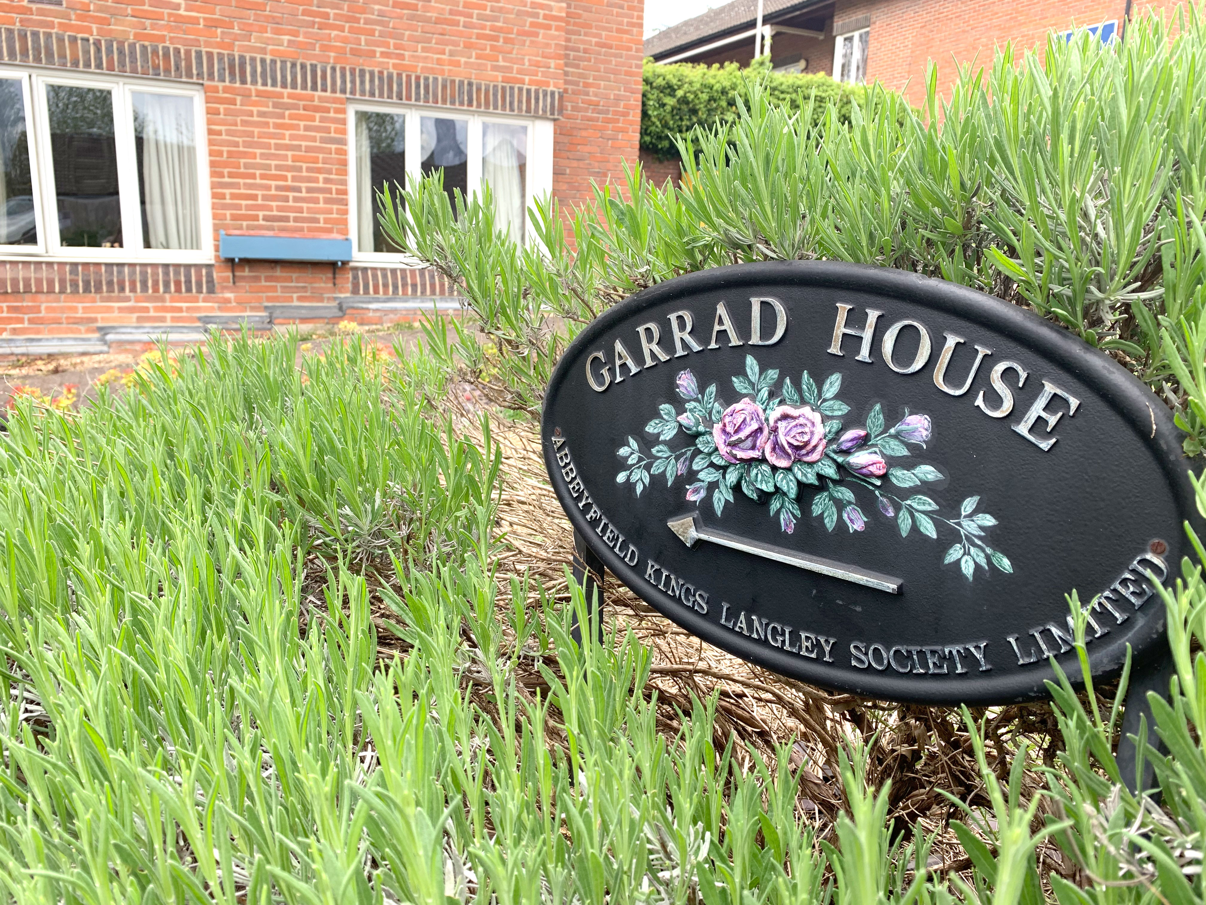 Garrad House sign at the front of the house