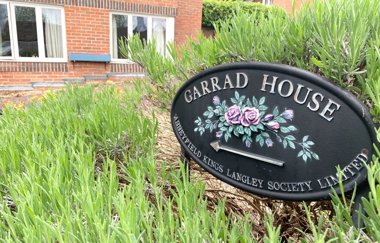 Garrad House sign at the front of the house