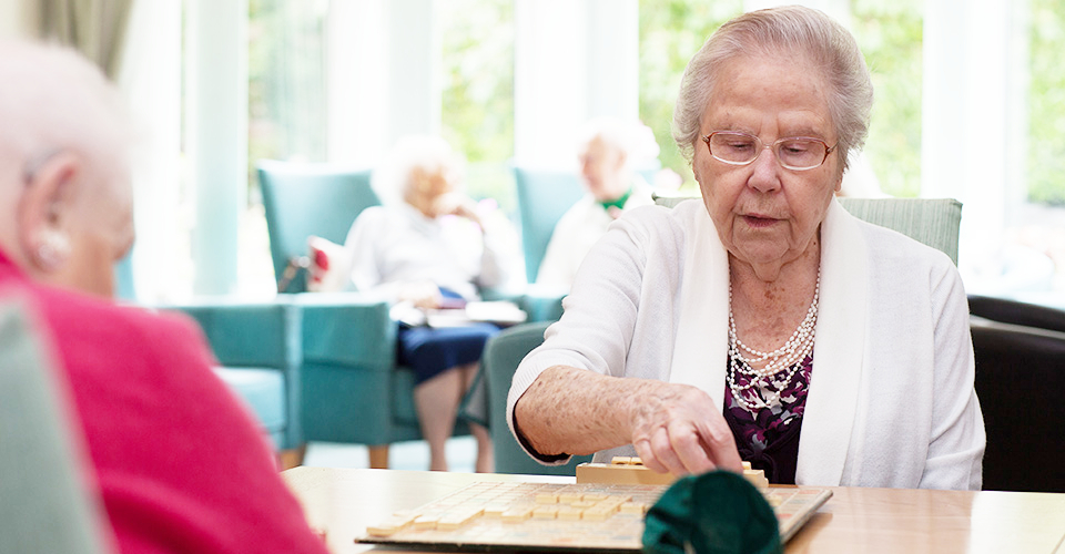 Residents in the lounge at Roundhay, Guildford GU1 2JH