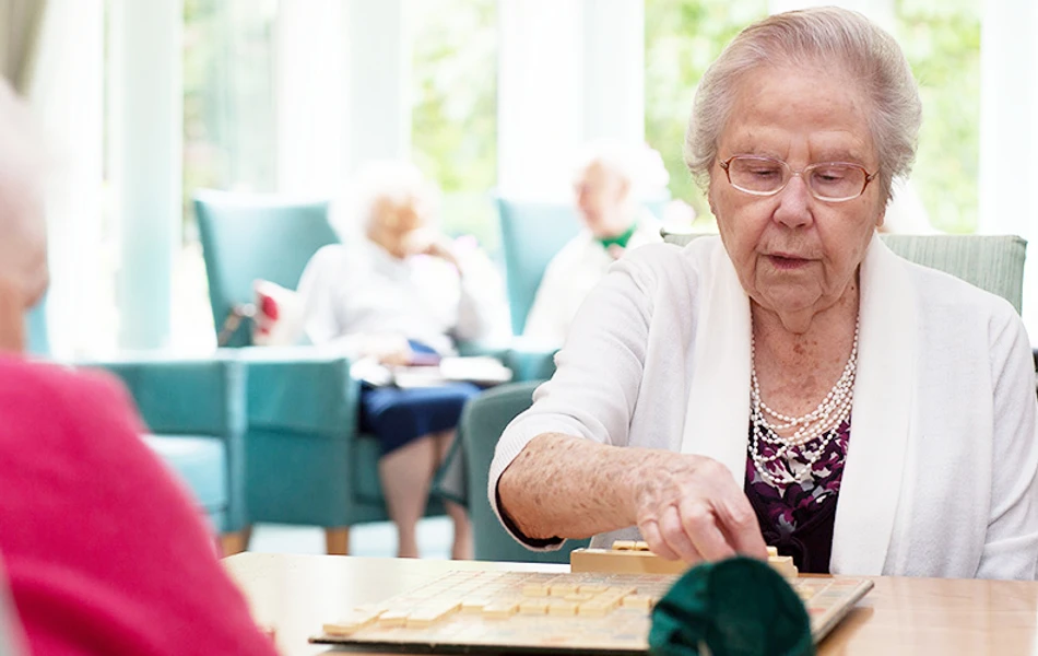Residents in the lounge at Roundhay, Guildford GU1 2JH
